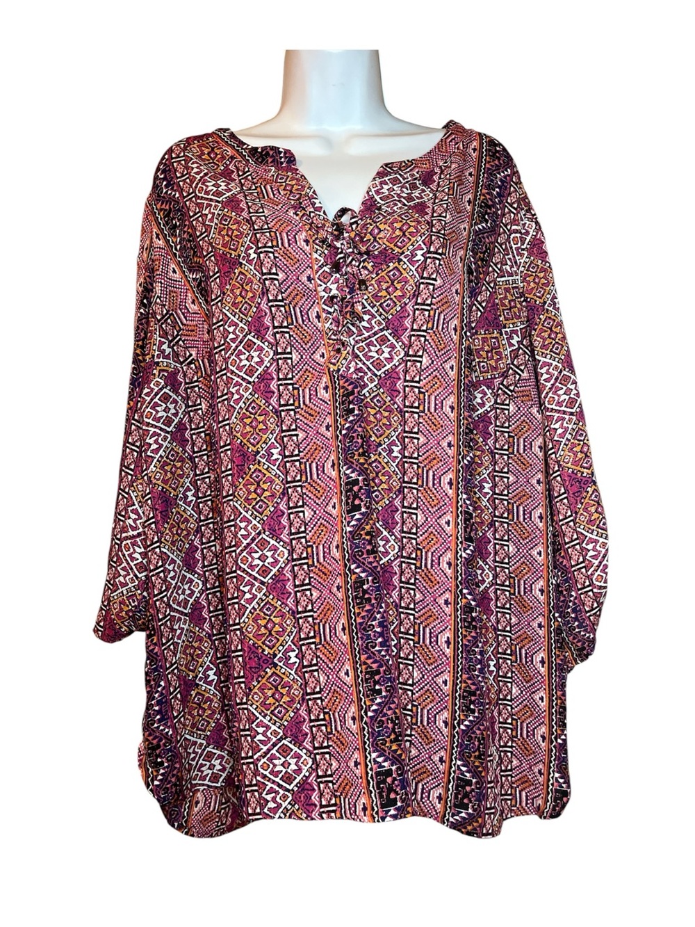A Faded Glory women’s plus pullover blouse in a multicolor geometric tie closure